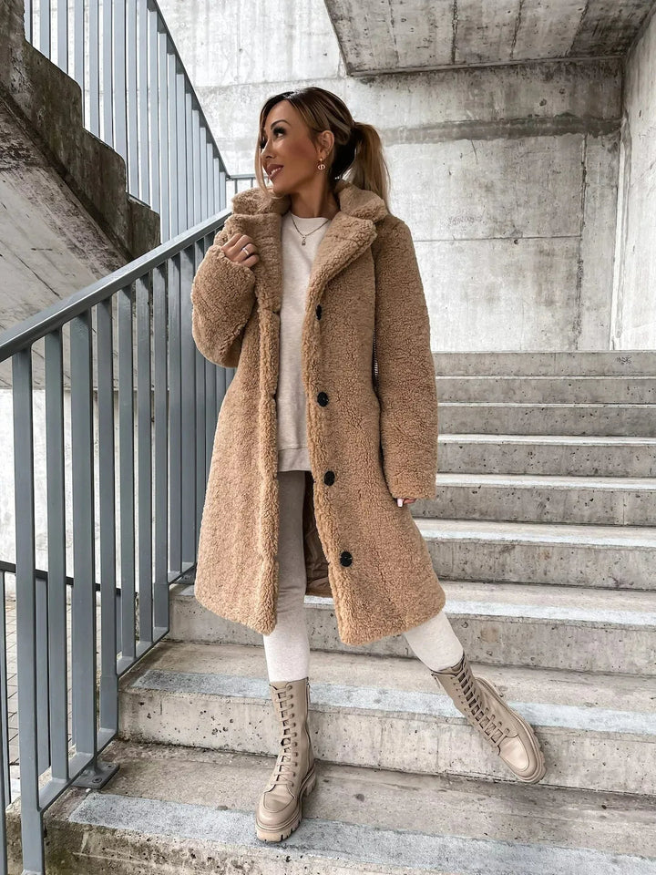 Women's cozy plush longline teddy trench coat in a warm, elegant style for winter fashion.