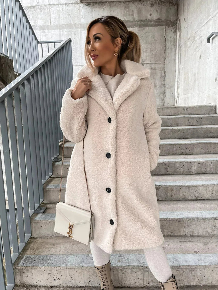 Warm longline teddy trench coat for women, cozy plush outerwear ideal for cold winter days.