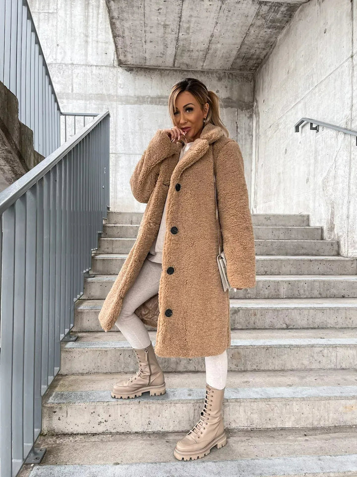 Cozy women's plush jacket, a longline teddy trench coat offering warmth and elegant outerwear.