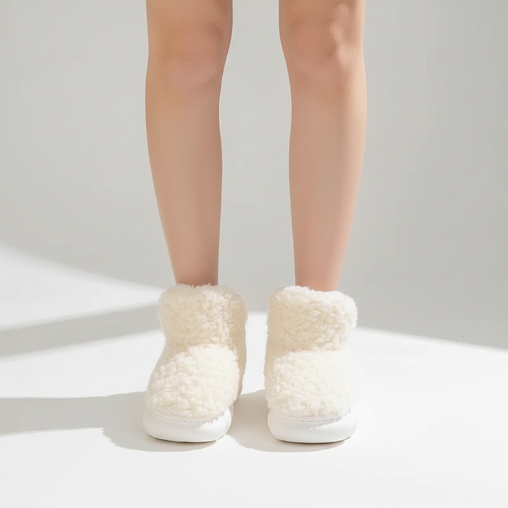 Stack of colorful women's plush slippers (pink, blue, gray), showcasing variety in warm footwear