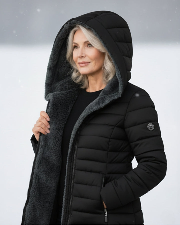 Women's warm green puffer coat, essential winter outerwear style.