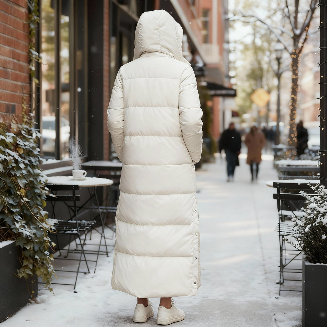 Chic women's long quilted winter coat with hood, perfect for fall fashion & everyday cold weather wear.