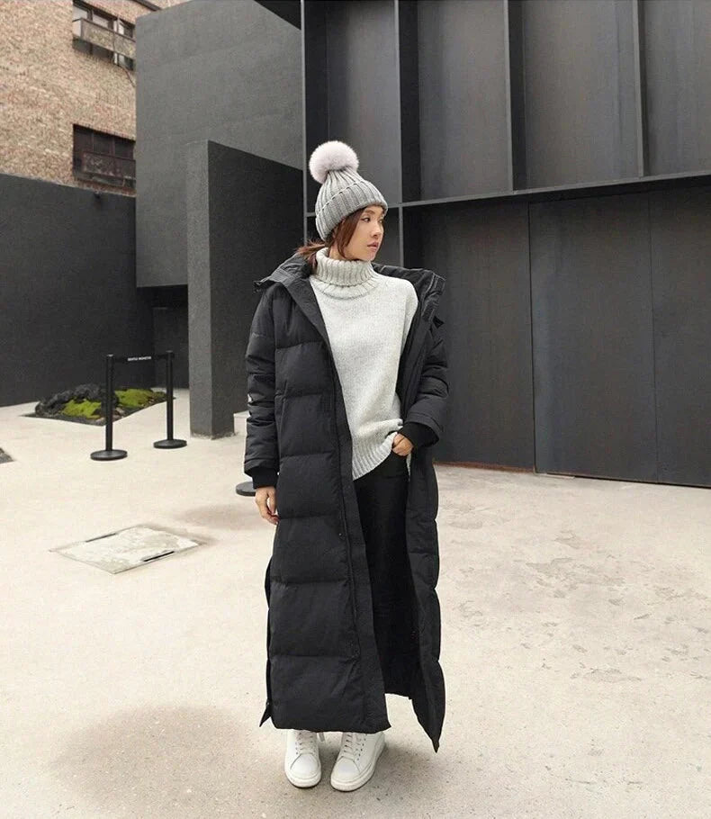 Elegant women's hooded quilted winter coat, providing warmth and chic style for cold days. Everyday comfort.