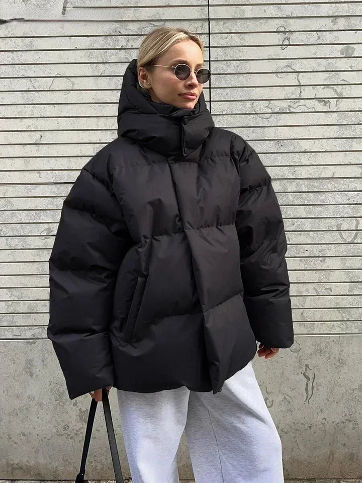 Fashionable women's quilted winter coat. Stay warm & stylish in cold weather with this cozy long sleeve jacket.