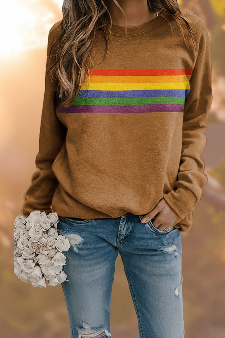Soft women's rainbow striped pullover sweater, a cozy and stylish top with vibrant retro design for comfort.