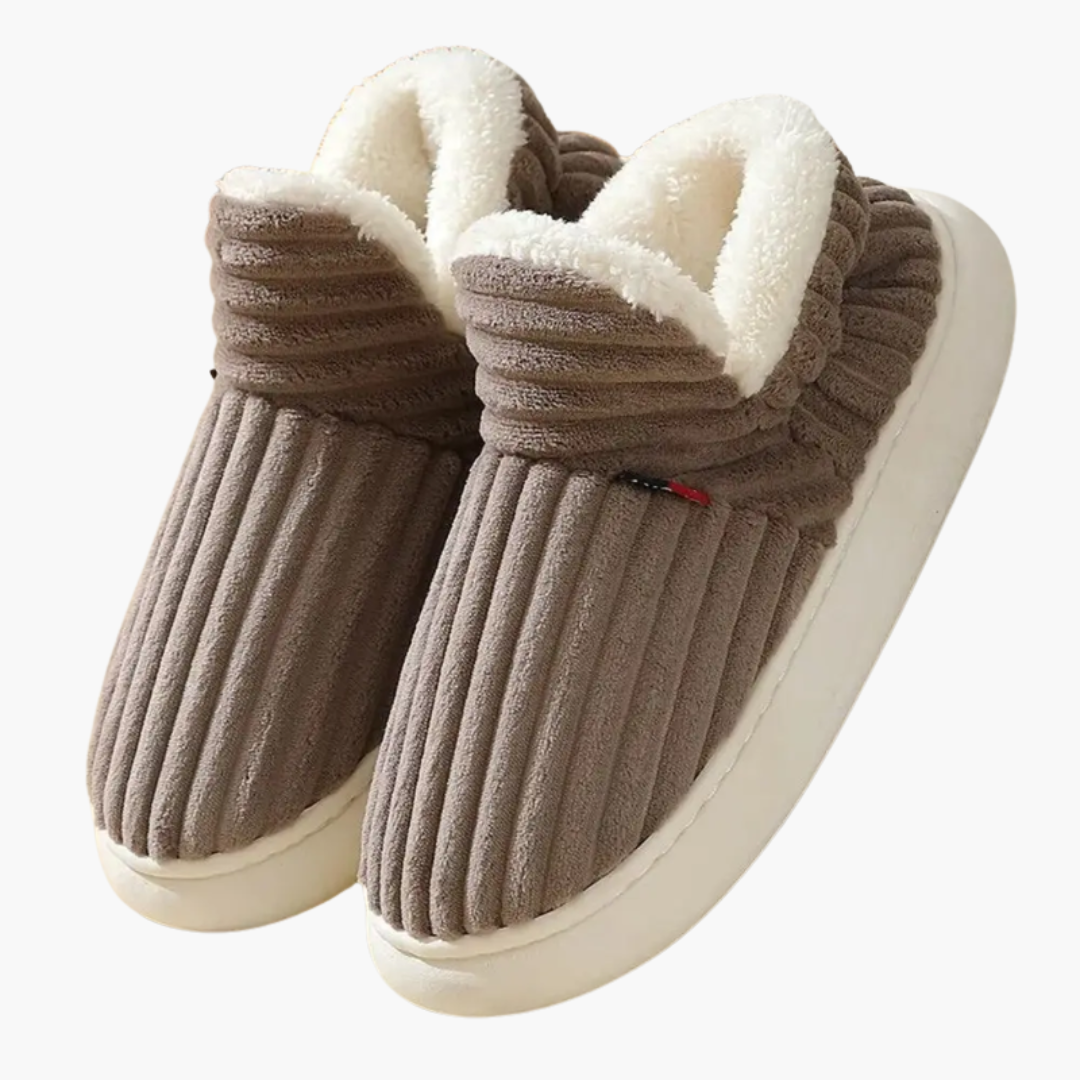 Soft women's ribbed bootie slippers, perfect for comfort, warmth, and relaxing home wear.
