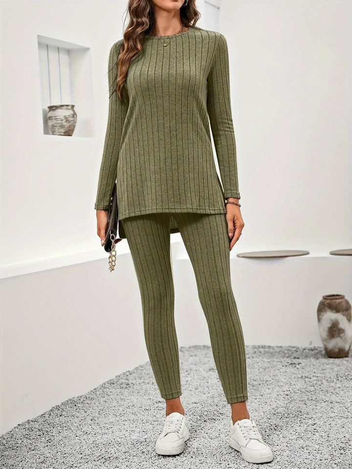 Woman in cozy ribbed knit lounge set, reading a book, embracing comfort and relaxation at home.