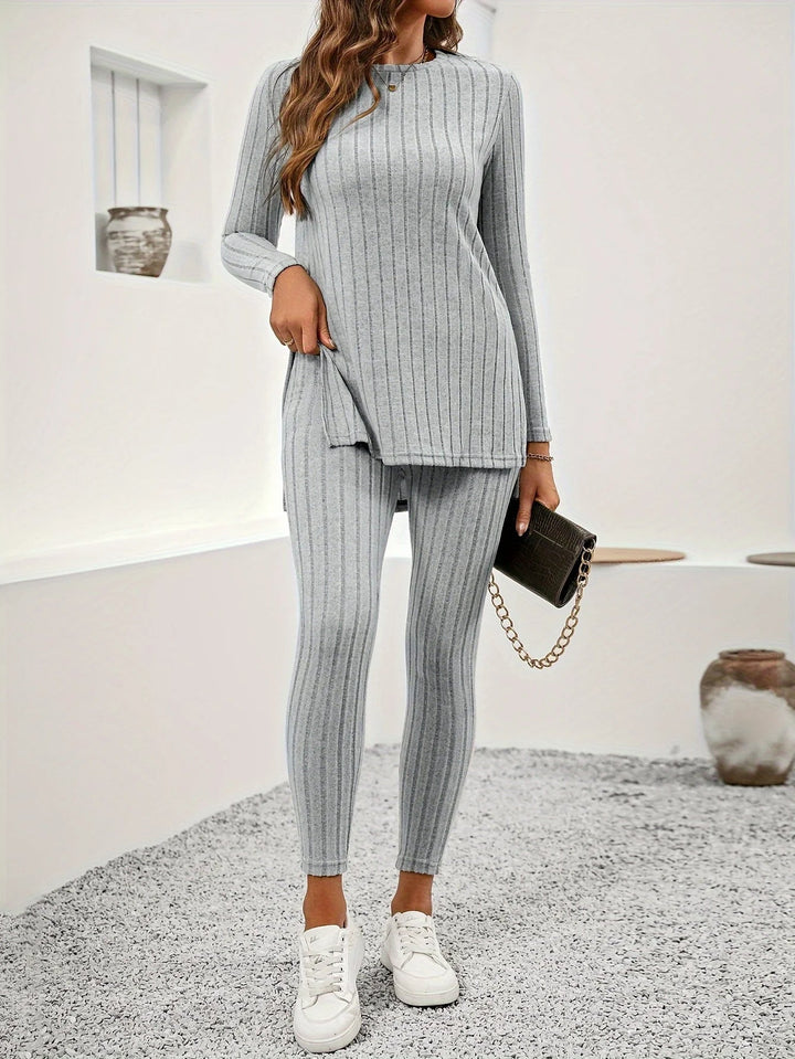 Woman wearing a comfortable ribbed knit lounge set, relaxing on a sofa, perfect for cozy at-home wear.