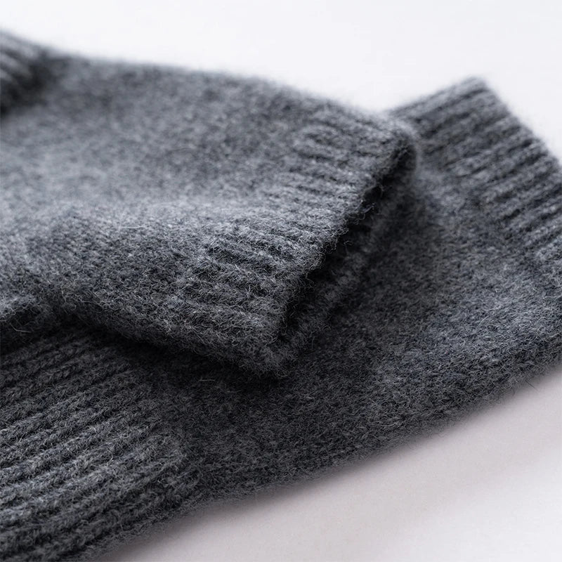 Pair of women's cozy knit fingerless gloves in a neutral tone, essential winter accessory.