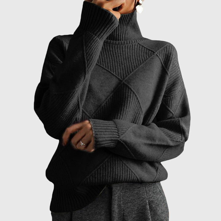Neatly folded women's roll neck sweater, ready for display, highlighting diagonal seam.