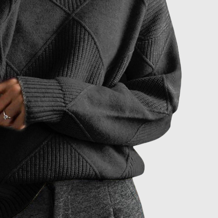 Women's cozy roll neck jumper on a hanger, showcasing full length and relaxed fit.
