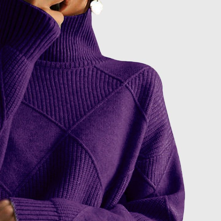 Long sleeve cuff detail on a warm, cozy knit women's roll neck jumper, comfortable fit.