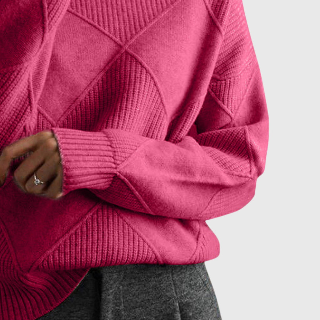 Elegant women's oversized jumper, warm roll neck knit with unique diagonal seam detail.