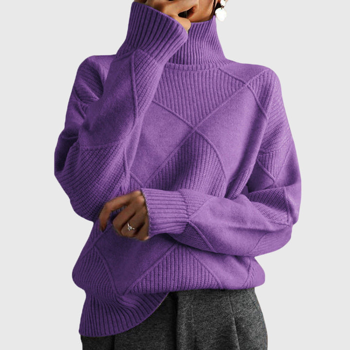 Detailed view of the chunky roll neck on a warm, elegant women's winter sweater.