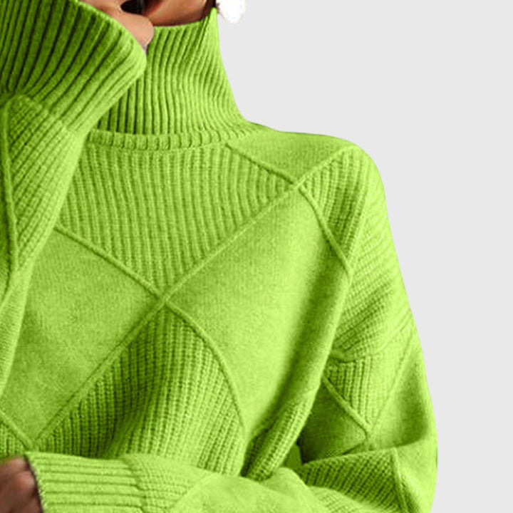Woman's face near cozy roll neck, highlighting warmth, stylish knit & elegant appeal.