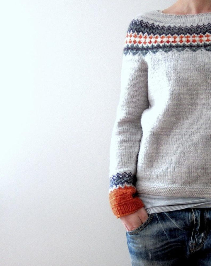 Stylish women's knit sweater with vibrant Scandinavian pattern, long sleeve.