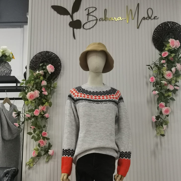 Trendy women's fall winter sweater with a vibrant Scandinavian knit pattern.