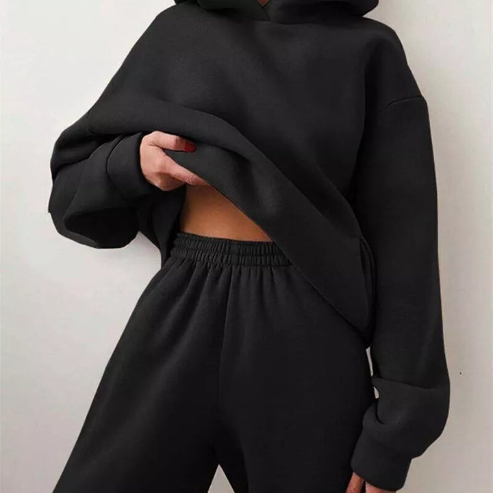 Comfortable women's two-piece hoodie and jogger set, designed for ultimate relaxation and cozy casual wear.