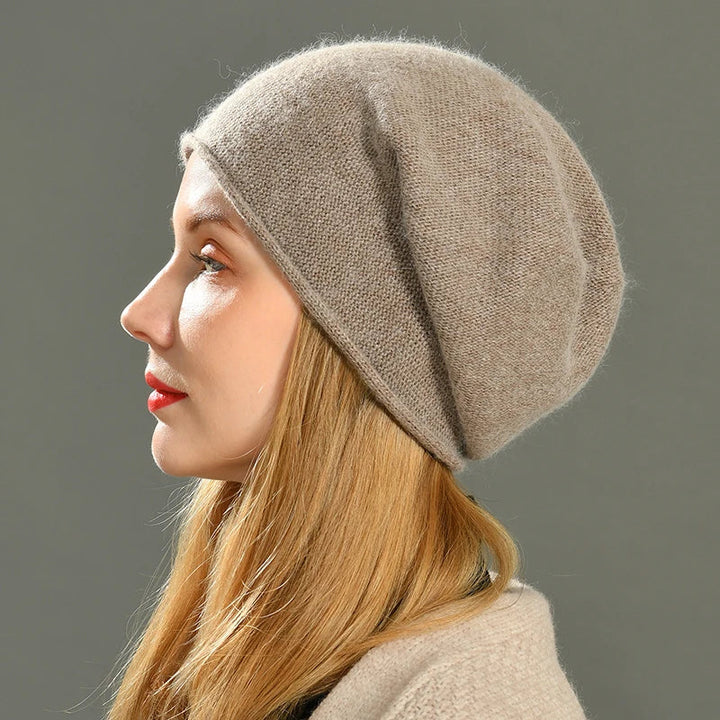 Women's cozy slouch beanie for chic winter warmth. Stylish knit hat, perfect for cold weather & casual wear.