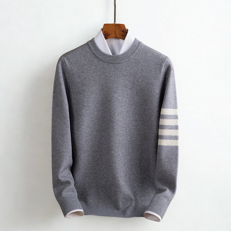 Close-up of a women's cozy striped pullover sweater, highlighting the soft knit texture for warmth & style.