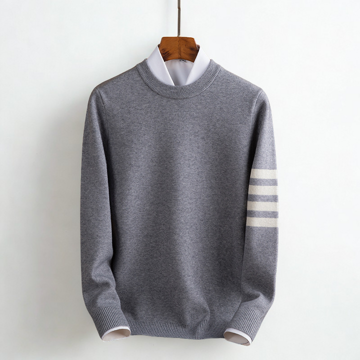 Close-up of a women's cozy striped pullover sweater, highlighting the soft knit texture for warmth & style.