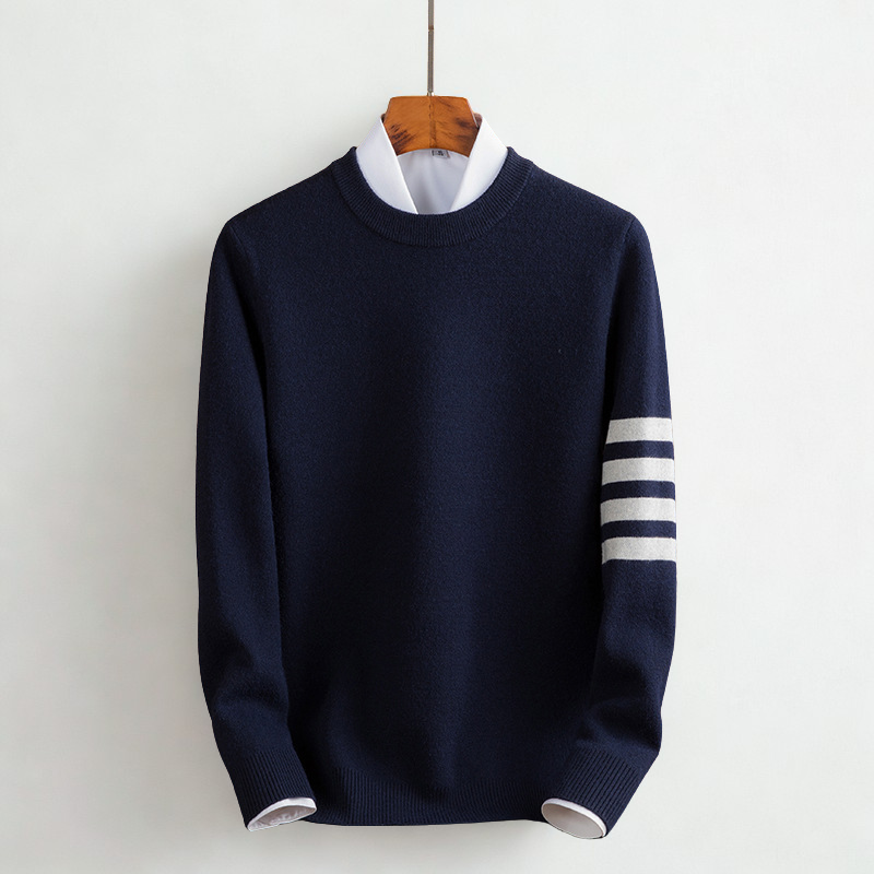Model wearing a women's cozy striped long sleeve pullover sweater, styled for a chic fall and winter look.