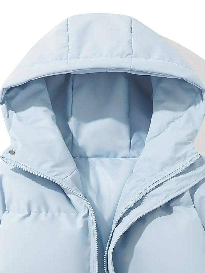 Women's hooded winter jacket with zipper detail. Cozy & warm long-sleeve outerwear, perfect for stylish comfort.