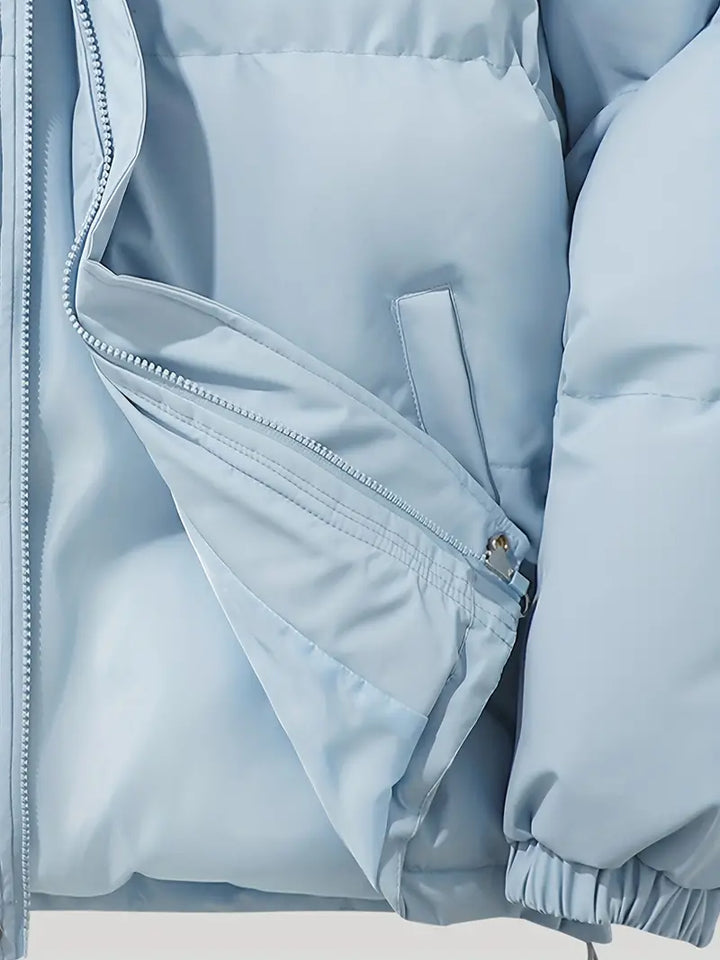 Women's warm hooded winter jacket, hood up. Cozy, stylish long-sleeve outerwear for maximum protection.