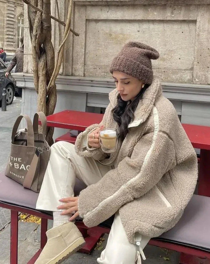 Women's cozy teddy coat in plush fabric, perfect for winter fashion. Stylish & warm outerwear.