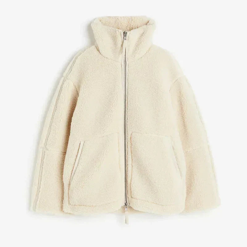 Back view of a women's plush teddy coat, demonstrating its cozy, oversized fit for winter comfort.