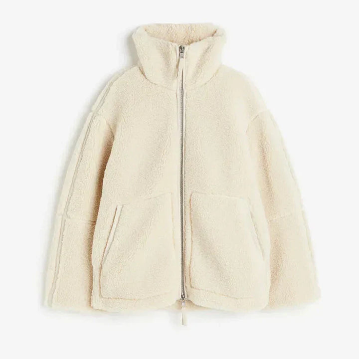 Back view of a women's plush teddy coat, demonstrating its cozy, oversized fit for winter comfort.