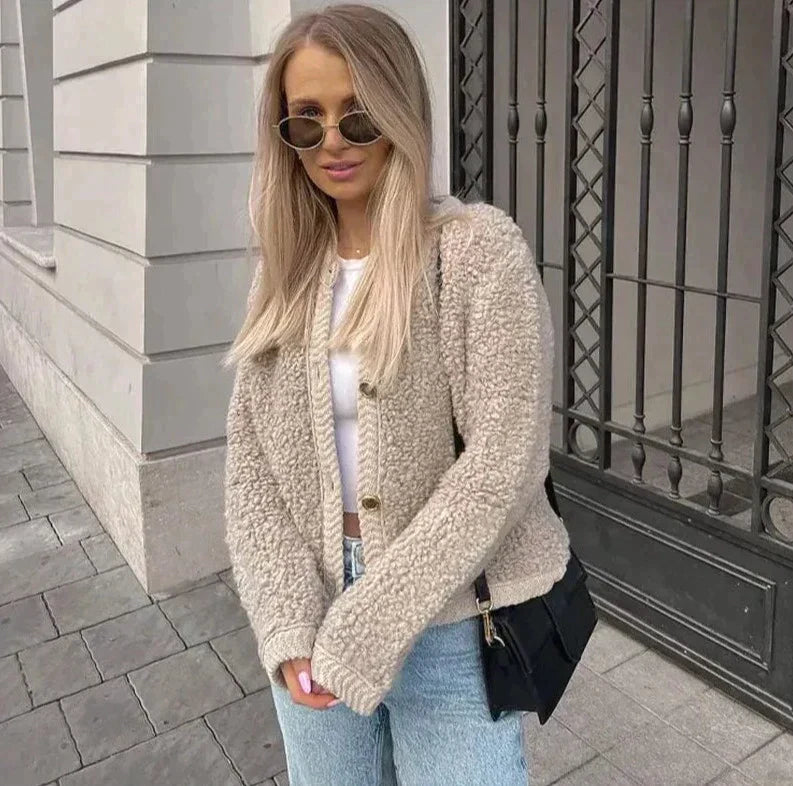 Soft women's teddy fleece vest for stylish layering, a warm & cozy cardigan perfect for winter fashion.