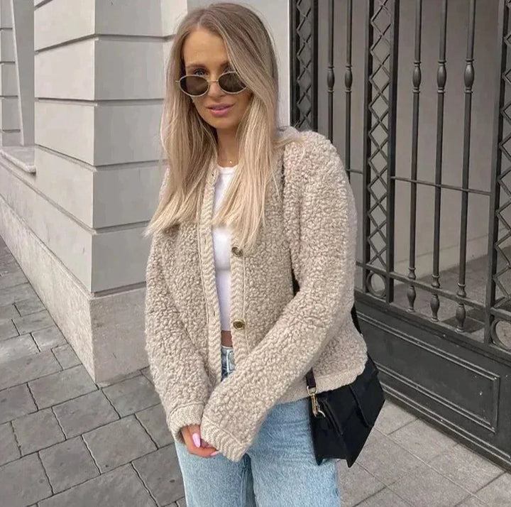 Soft women's teddy fleece vest for stylish layering, a warm & cozy cardigan perfect for winter fashion.