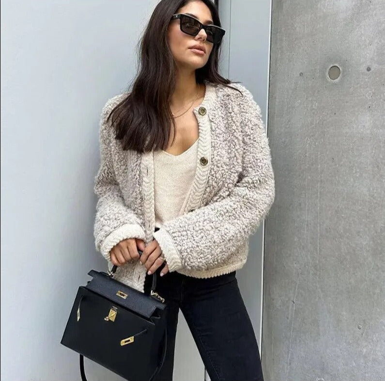 Ultra-cozy women's teddy fleece vest, a warm and soft outerwear piece for cold weather and layering.