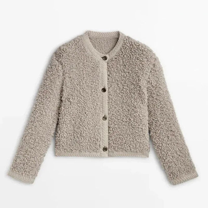 Luxuriously soft women's teddy fleece vest, warm & cozy outerwear for winter fashion layering.