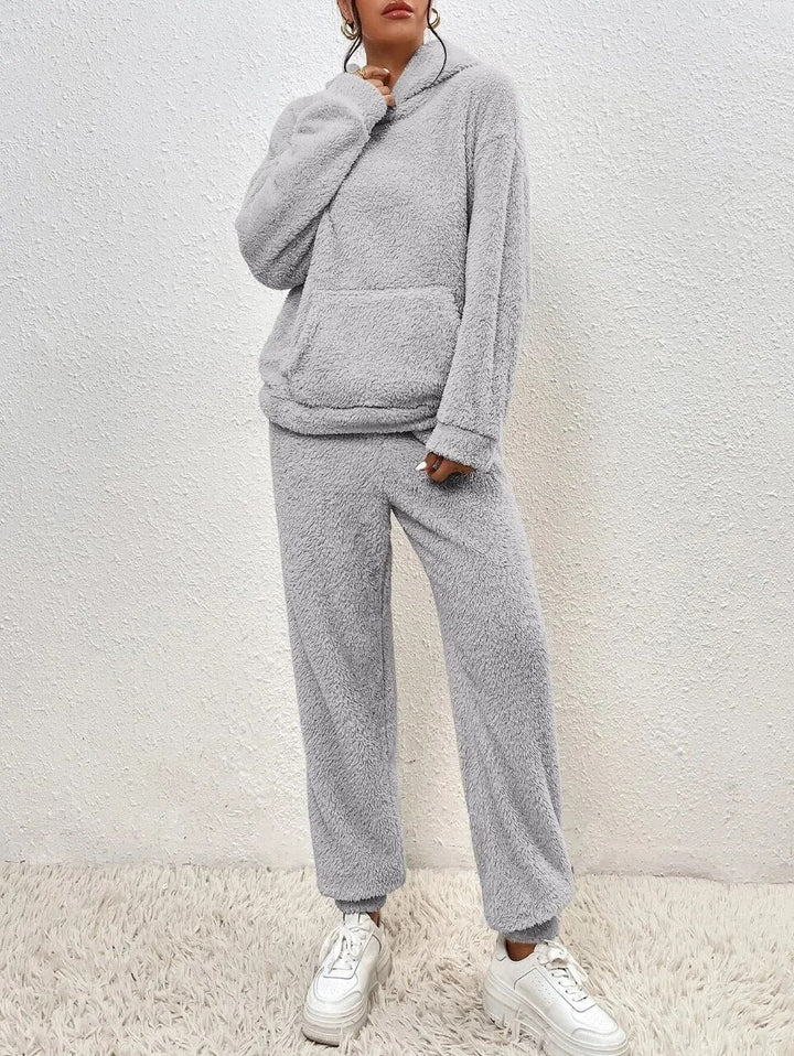 Stylish women's hooded teddy loungewear set. Soft two-piece outfit for ultimate relaxation.