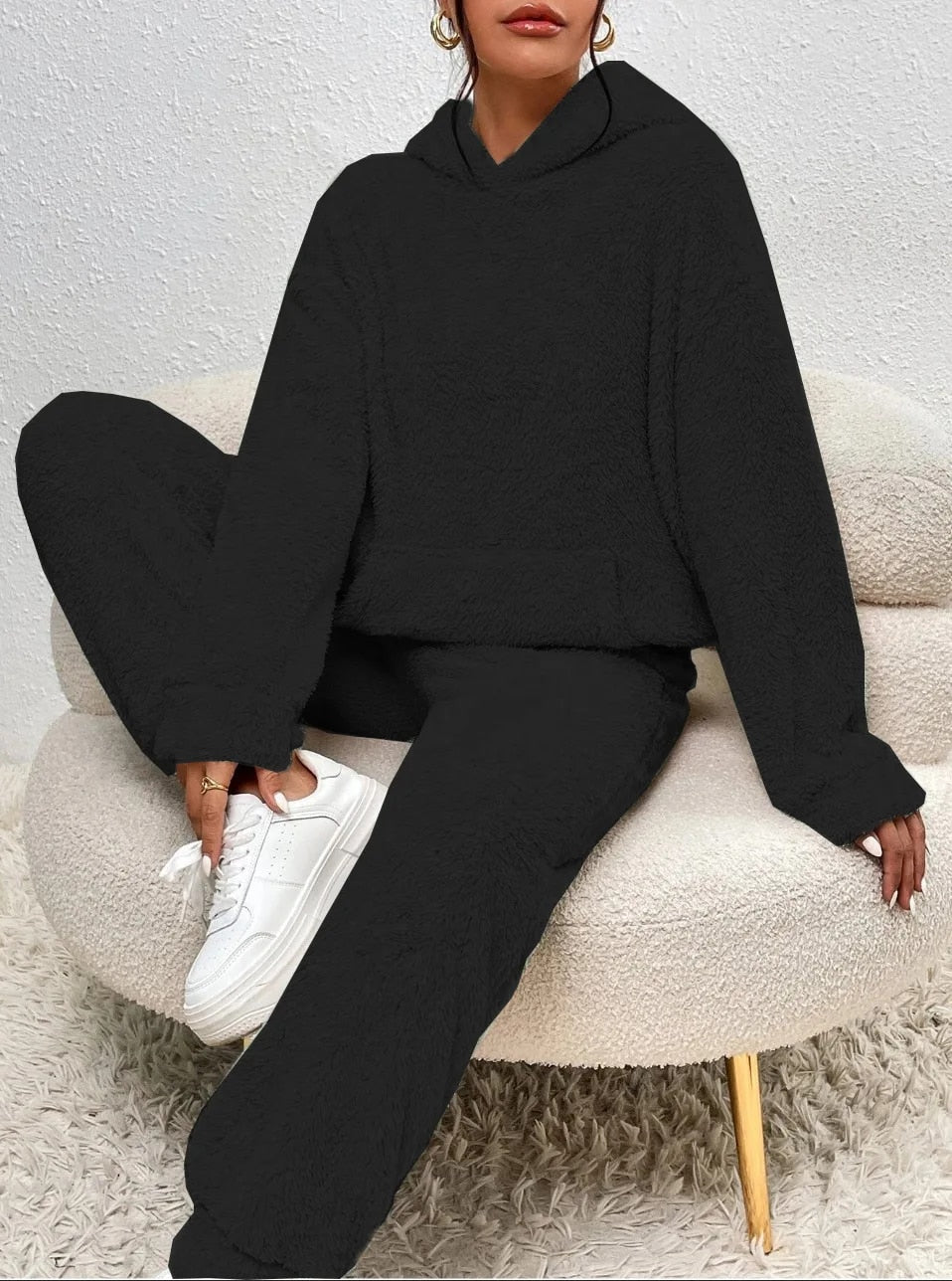 Cozy teddy loungewear set for women. Hooded design, soft fabric, perfect for winter comfort.