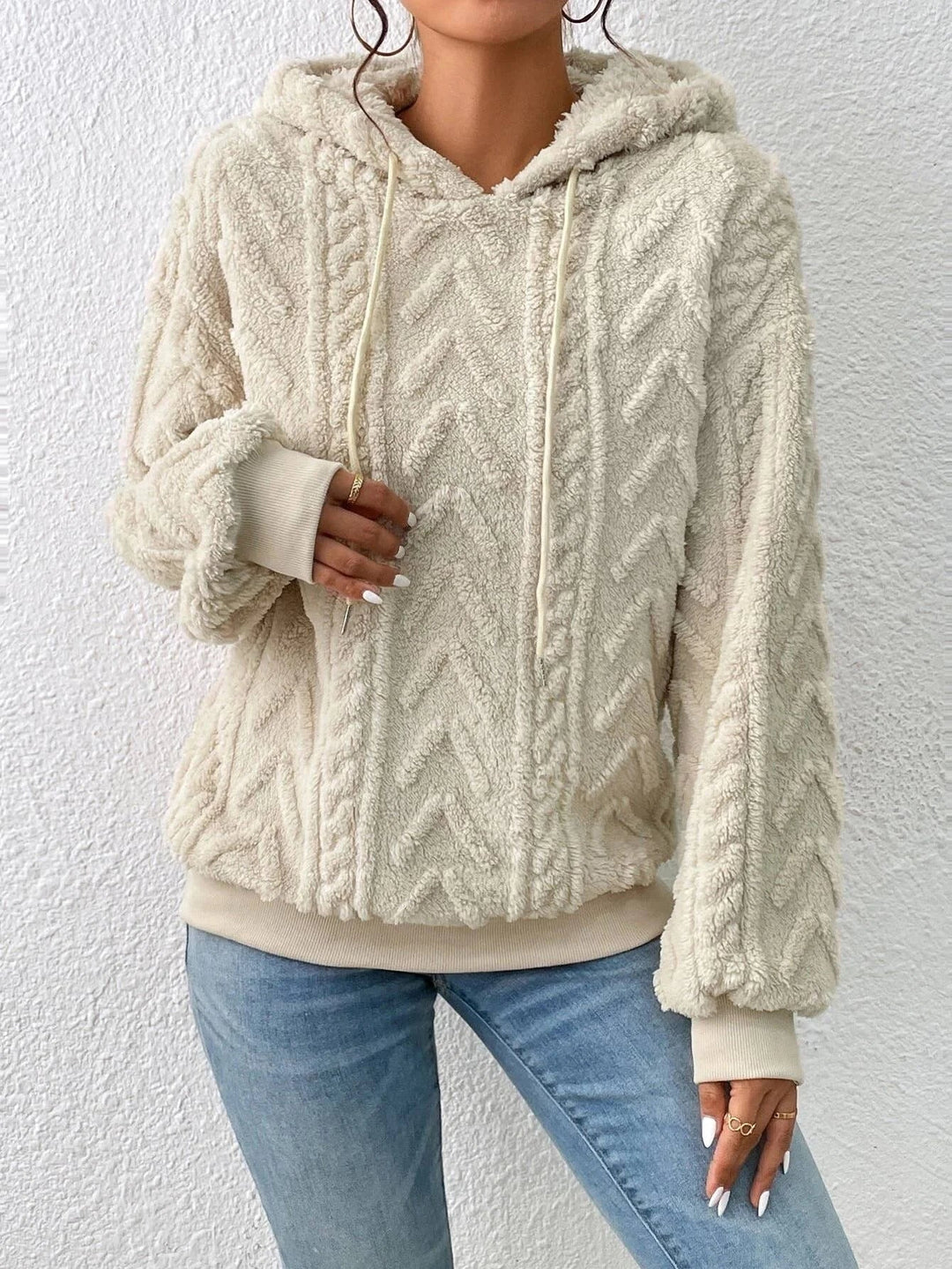Chic women's textured pullover hoodie with an oversized fit, ideal for casual, comfortable winter fashion.