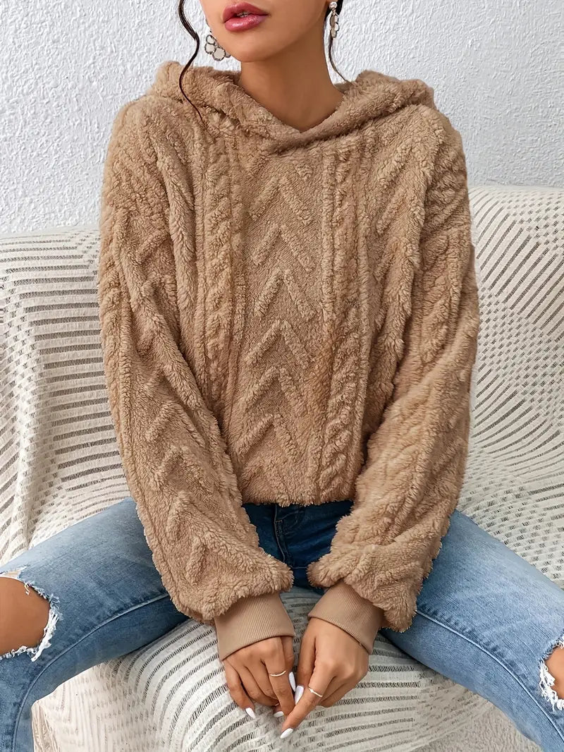Women's soft feel pullover hoodie, a textured sweater offering relaxed comfort and casual style.