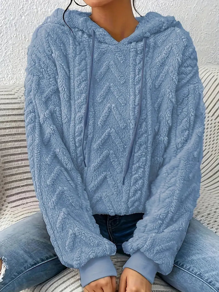 Textured women's pullover hoodie, a chic and cozy top designed for comfortable everyday casual wear.