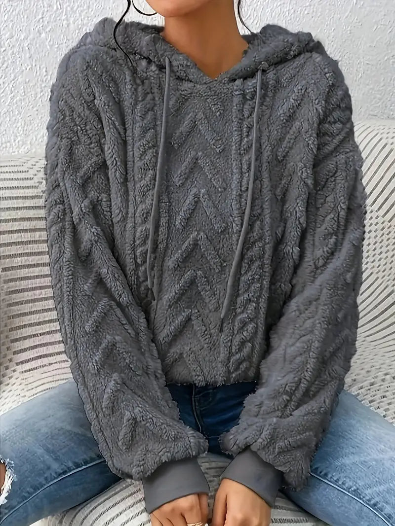 Relaxed fit women's textured pullover hoodie, a versatile, comfortable top for cozy layering and casual style.