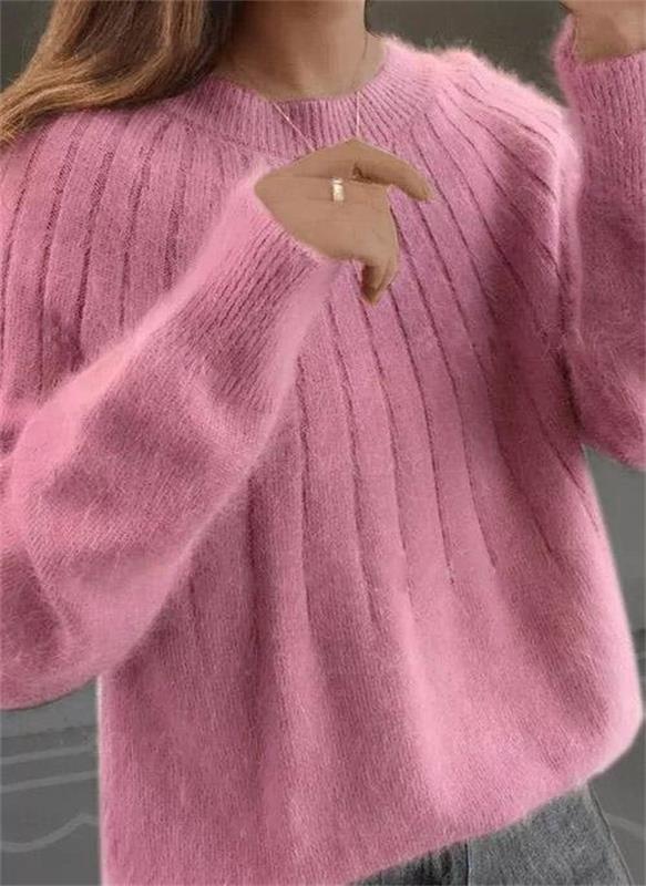 Stylish women's textured pullover, versatile for chic casual outfits and comfortable layering.
