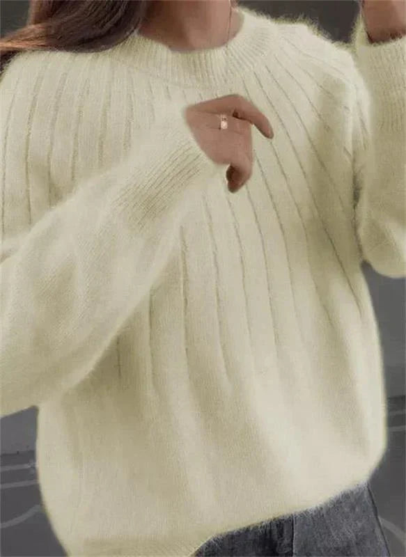 Women's textured knit long sleeve crew neck pullover, offering a cozy and stylish look.