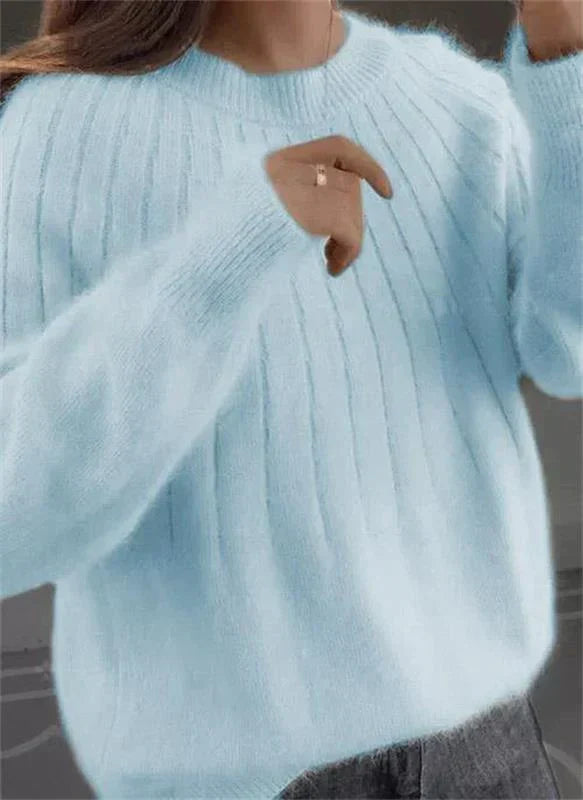 Chic women's textured long sleeve pullover, designed for a stylish yet relaxed feel.
