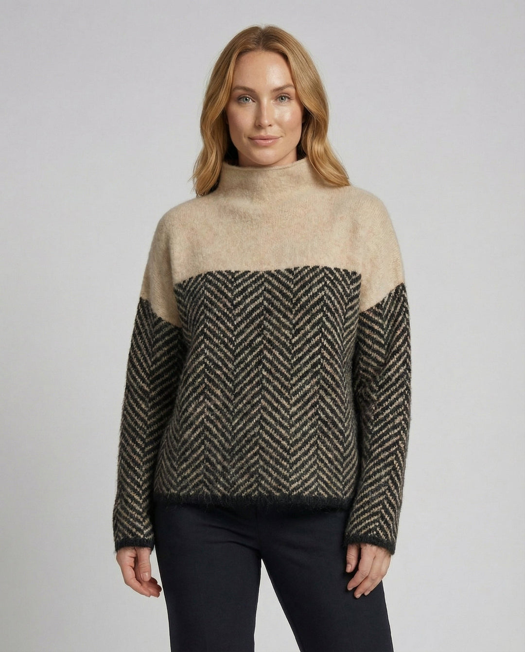Stylish women's loose-fit textured knit turtleneck sweater, ideal for casual and office wear.