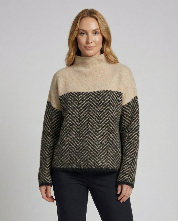 Stylish women's loose-fit textured knit turtleneck sweater, ideal for casual and office wear.