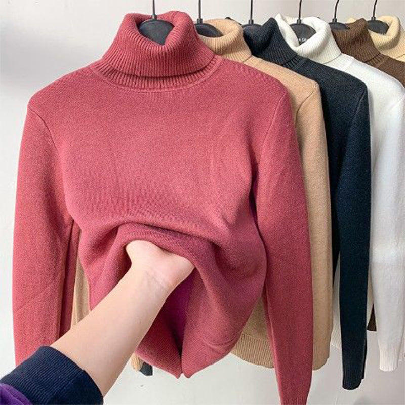 Stay warm in this women's cozy turtleneck sweater. An essential long-sleeve top for winter fashion.