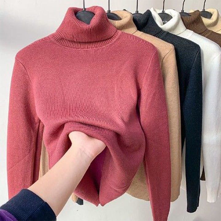 Stay warm in this women's cozy turtleneck sweater. An essential long-sleeve top for winter fashion.