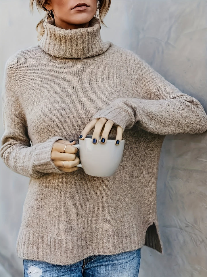 Versatile women's winter turtleneck sweater, relaxed fit, long sleeve, and modern side split hem.