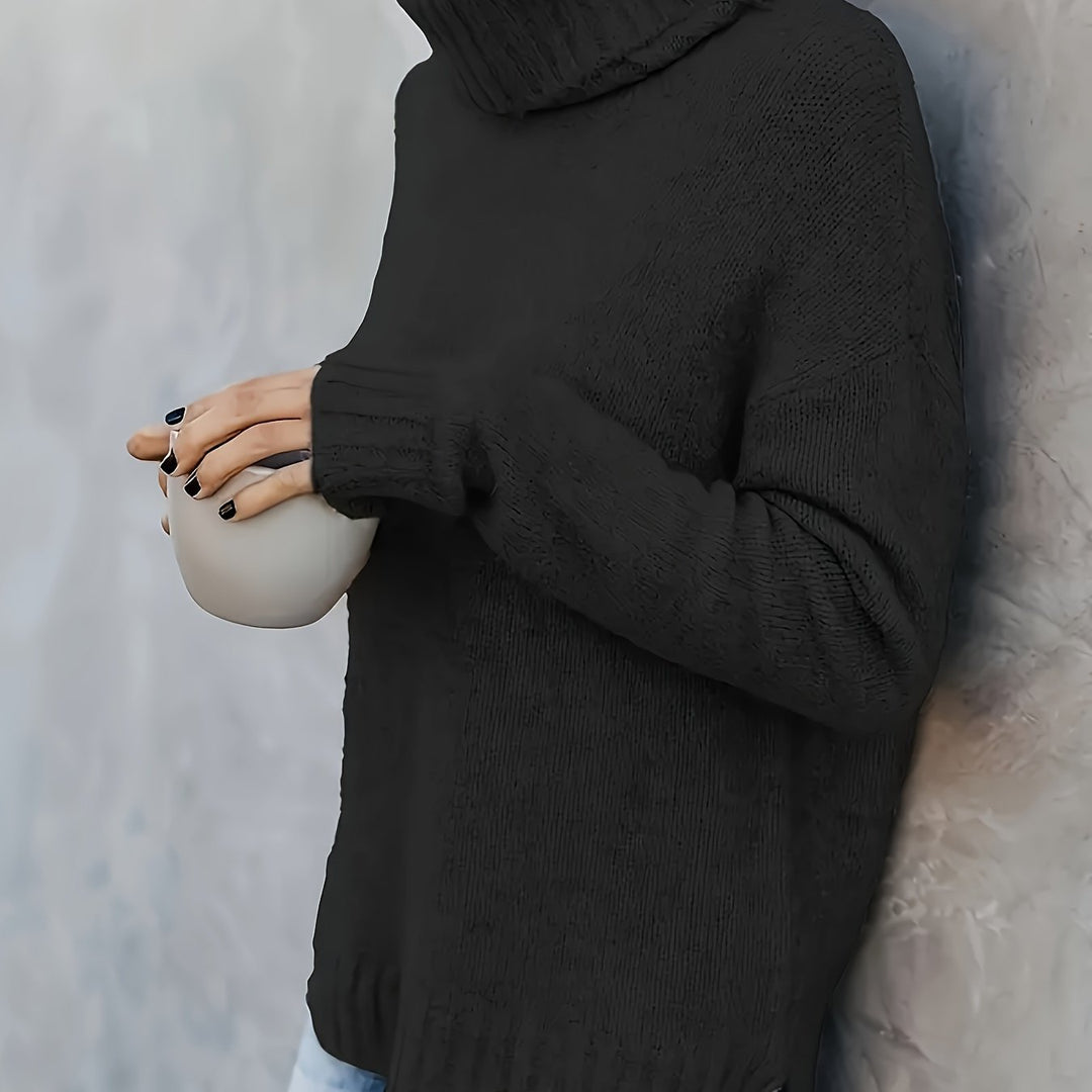 Women's relaxed fit long sleeve turtleneck sweater, featuring a stylish side split hem. Great for winter.